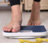 Woman Stepping on Scale